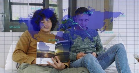Relaxing friends reading travel book and using smartphone on sofa with global map overlay