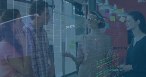 Diverse Group Discussing Financial Data with Digital Interface