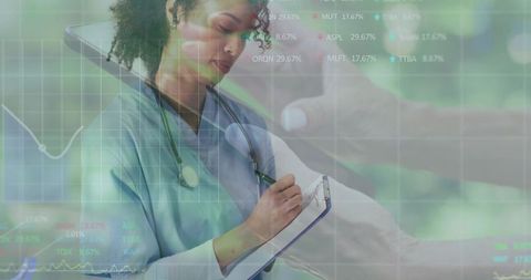 Nurse writing patient vitals while activating overlaid medical data on touchscreen dashboard