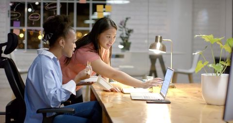 Businesswomen Collaborating in Modern Office Space - Download Free Stock Images Pikwizard.com
