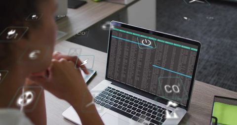 Checking woman scanning laptop terminal with holographic data overlay at office desk