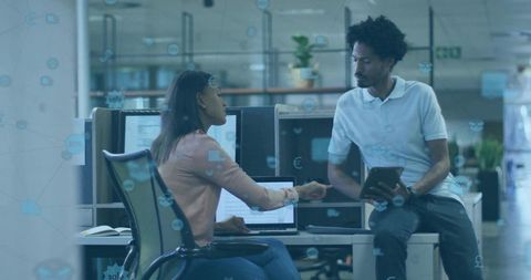 Colleagues Collaborating in Modern Office Digital Technology