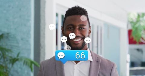 Businessman smiling in office with chat notification overlay