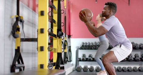 Diverse Individuals Strength Training with Medicine Balls at Gym - Download Free Stock Images Pikwizard.com