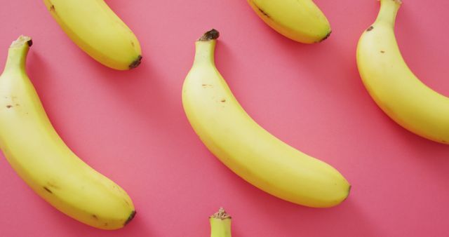 Image of fresh bananas on pink background. fusion food, fresh fruit and healthy eating concept.