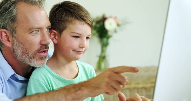 Father and Son Engaged in Learning at Computer Together - Download Free Stock Images Pikwizard.com