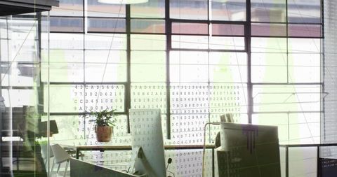 Open-Plan Office with Code Overlay on Glass, Monitors and Potted Plant in Minimal Workspace