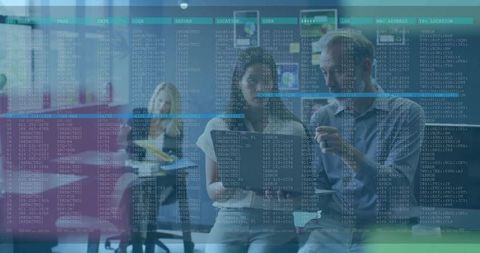 IT Professionals Analyzing Data on Digital Screen in Modern Office