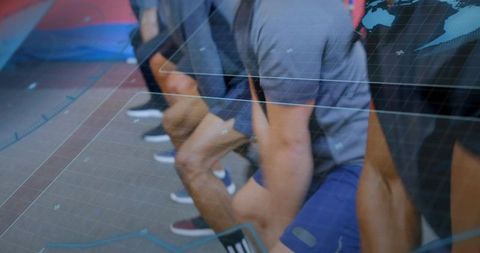 Athletes kneeling at sprint start with digital grid overlay for training and performance