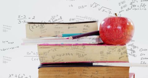 Education Concept: Books, Apple, Formulas Symbolizing Learning - Download Free Stock Images Pikwizard.com