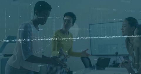 Women Collaborating on Data Visualization in Modern Office Setting