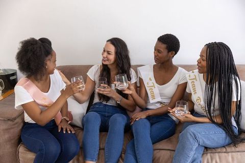 Diverse Female Friends Toasting at Bridal Celebration Gathering