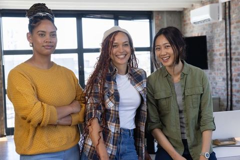 Diverse Women Collaborating in Modern Office Environment