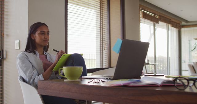 Woman Reflecting While Working on Laptop at Home With Coffee - Download Free Stock Images Pikwizard.com