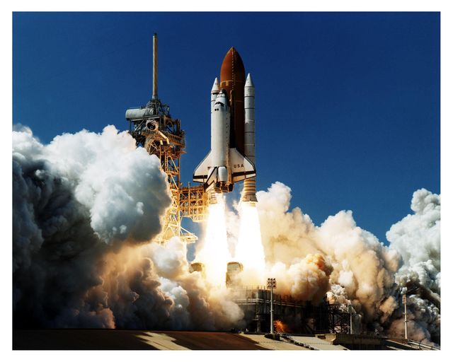 Space Shuttle Columbia ascends from Launch Pad 39A for the 16-day Microgravity Science Laboratory-1 mission. This image is ideal for illustrating concepts of space exploration, rocket technology, NASA missions, and crewed space flights. It can be used in educational materials, articles about space history, and promotional materials for aerospace advancements.