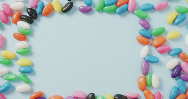 Colorful Assorted Jelly Beans Lined in Frame Shape on Blue Background - Download Free Stock Images Pikwizard.com