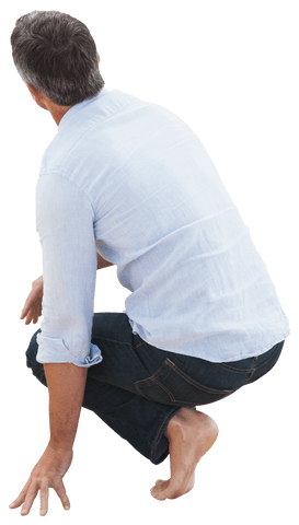 Rear View of Man Crouching in Casual Blue Shirt on Transparent Background
