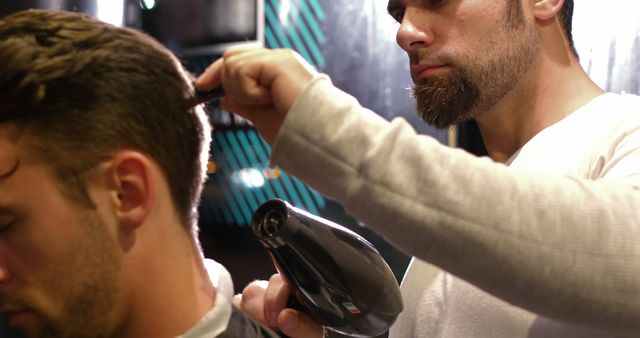 Barber Styling Hair of Client with Hairdryer and Comb - Download Free Stock Images Pikwizard.com