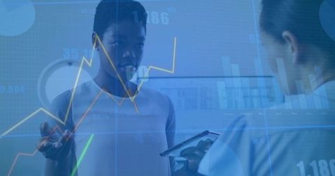 Medical professionals analyzing digital health data using tablet