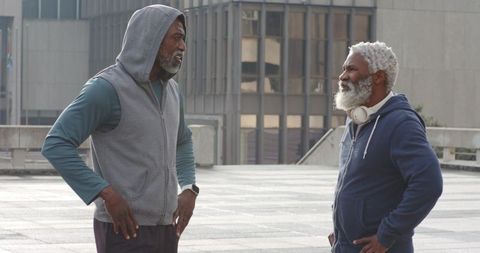 Senior African American Men Discussing Fitness on Urban Rooftop