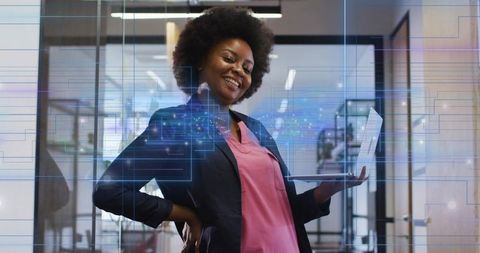 Confident Businesswoman Embracing Futuristic Technology in Modern Office