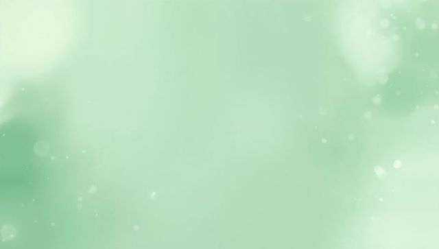 Soft mint bokeh gradient featuring glowing light flares and subtle speckled texture