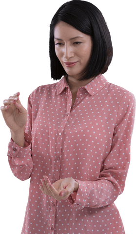 woman pretending to hold transparent object in polka dot shirt - Download Free Stock Videos Pikwizard.com