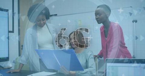 Women Collaborating on 6G Technology Innovations at Office