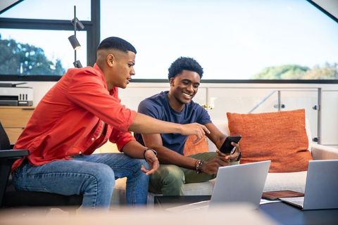 Teamwork Inspiration in Office Lounge with Technology