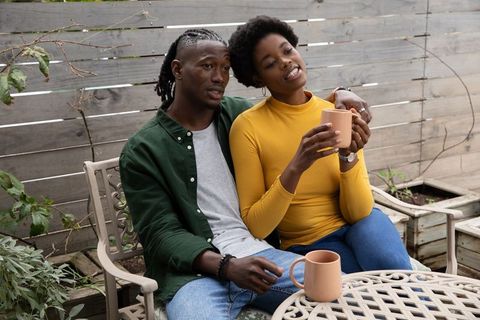 Romantic African American Couple Relaxing on Rustic Patio