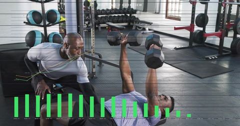 Trainer spotting athlete bench pressing dumbbells with green data overlay for gym analytics