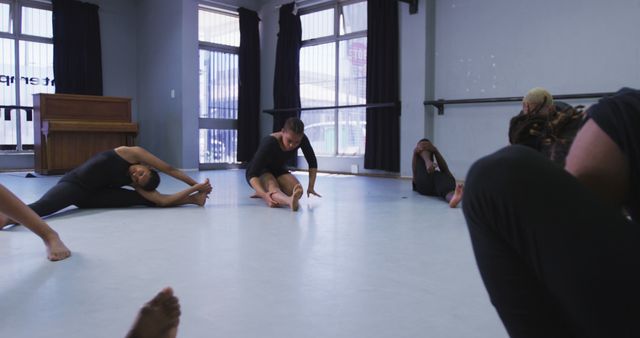 Group of Diverse Adults Stretching During Dance Class in Studio - Download Free Stock Images Pikwizard.com