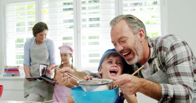 Family Baking Together in Bright Kitchen - Download Free Stock Images Pikwizard.com