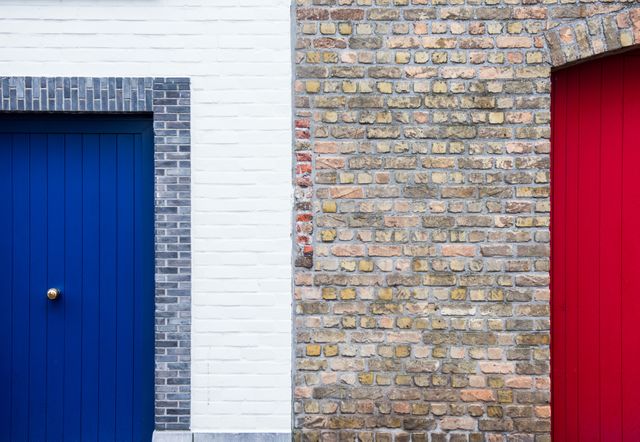 Contrasting Blue and Red Doors on Brick Walls - Download Free Stock Photos Pikwizard.com