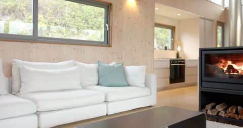 Modern Minimalist Living Room with Cozy Fireplace Atmosphere