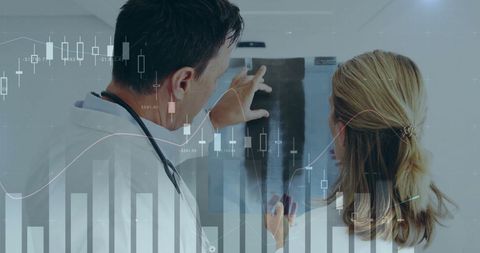 Doctors Analyzing X-Ray with Digital Financial Overlay - Download Free Stock Images Pikwizard.com
