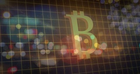 Bitcoin symbol over urban grid with city lights bokeh effect