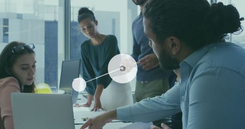 diverse team collaborating over reports with digital interface - Download Free Stock Images Pikwizard.com