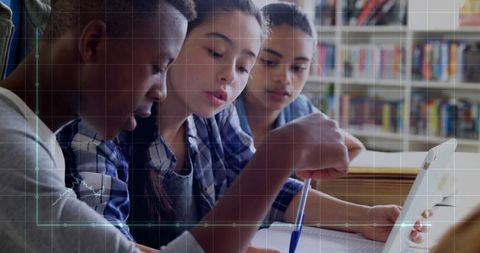 Diverse Teenagers Collaborate on School Project in Library