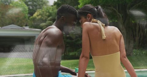 Backyard pool couple leaning close in swimwear sharing intimate summer romance moment