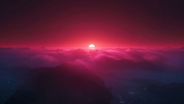 Vibrant Sunrise Above Cloud-Covered Mountain Peaks
