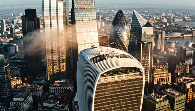 Soaring above london skyline capturing walkie talkie rooftop, gherkin and river thames glow