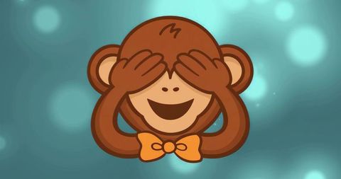Playful brown monkey covering eyes with orange bow tie on teal bokeh background