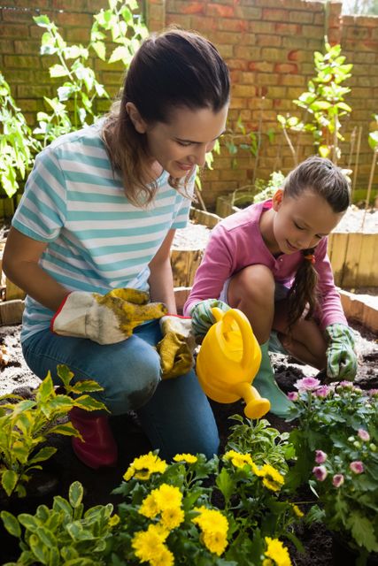 Mother and Daughter Gardening Together in Backyard - Download Free Stock Photos Pikwizard.com