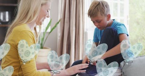 Mother Tying Son's Shoe in Loving Family Moment