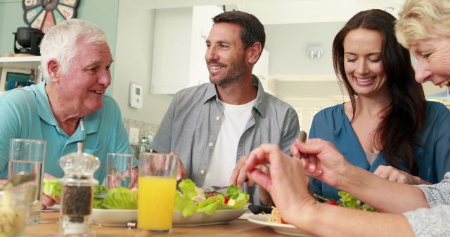 Happy Family Enjoying Meal Together in Cozy Kitchen - Download Free Stock Images Pikwizard.com