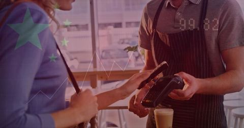 Customer Using Mobile Payment at Coffee Shop Counter