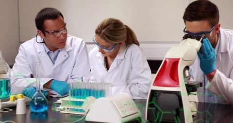 Scientists Researching in Laboratory with Advanced Equipment