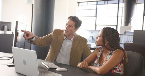 Diverse Colleagues Collaborating Over a Business Project in Modern Office - Download Free Stock Images Pikwizard.com