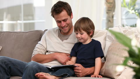 Father and Son Reading Storybook Together